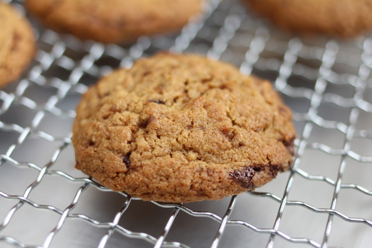 Whole grain Einkorn chocolate chip cookie cooling on a wire rack