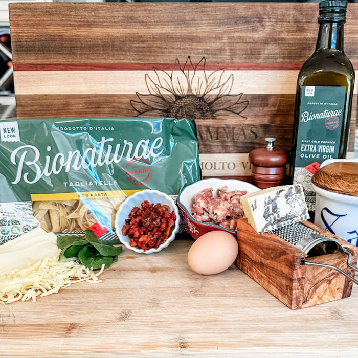 Sausage and spinach frittata ingredients: Bionaturae tagliatelle, sausage, egg, grated cheese, sun-dried tomatoes, olive oil