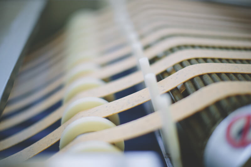 Sourdough crackers moving on a conveyor belt in an artisan bakery production line