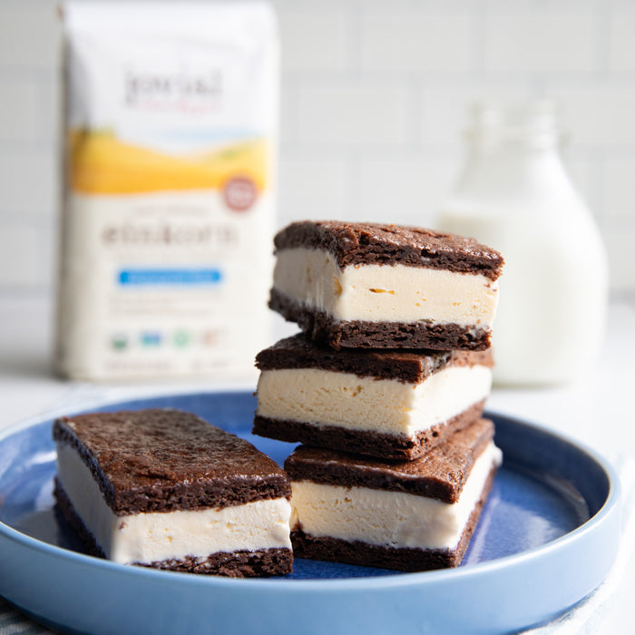 Einkorn chocolate ice cream sandwiches with thick vanilla filling between chocolate cookie layers