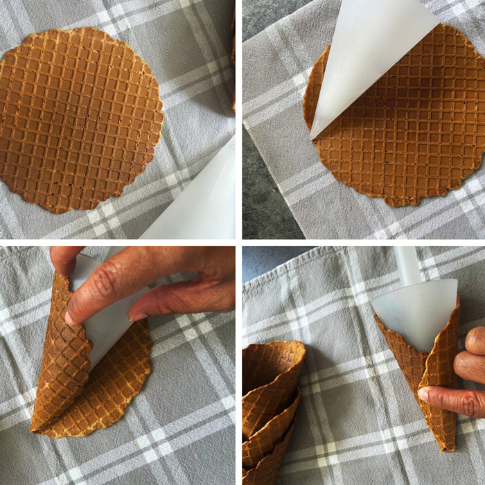 Einkorn sourdough waffle being shaped into ice cream cones on a gray plaid towel