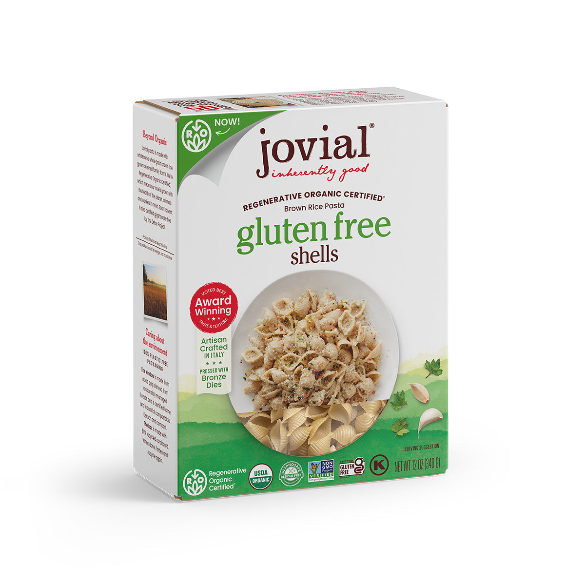 Angled view of Jovial organic brown rice gluten free shells box showing front label and bowl of pasta on white background