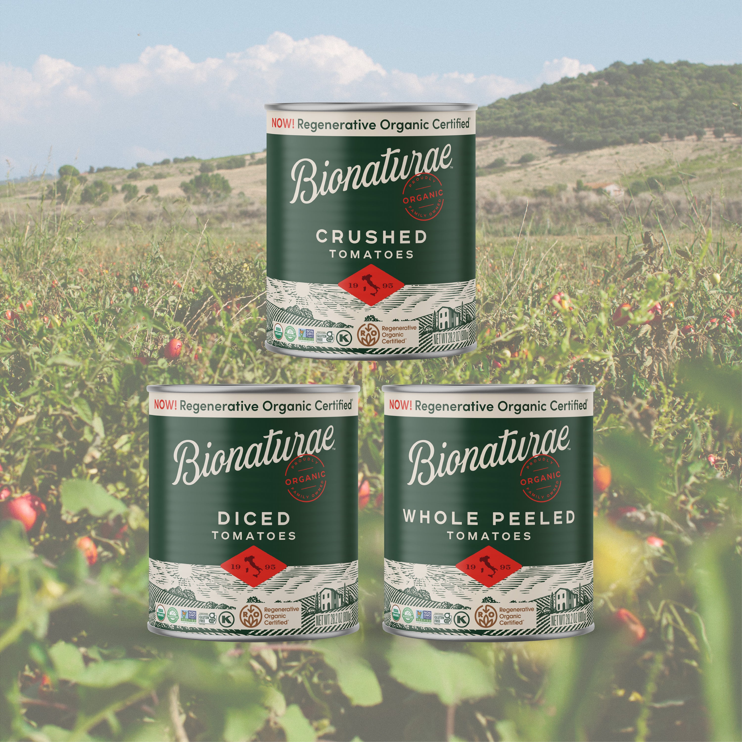 Front view of three Bionaturae cans: Crushed, Diced, Whole Peeled, showing Regenerative Organic label over tomato field