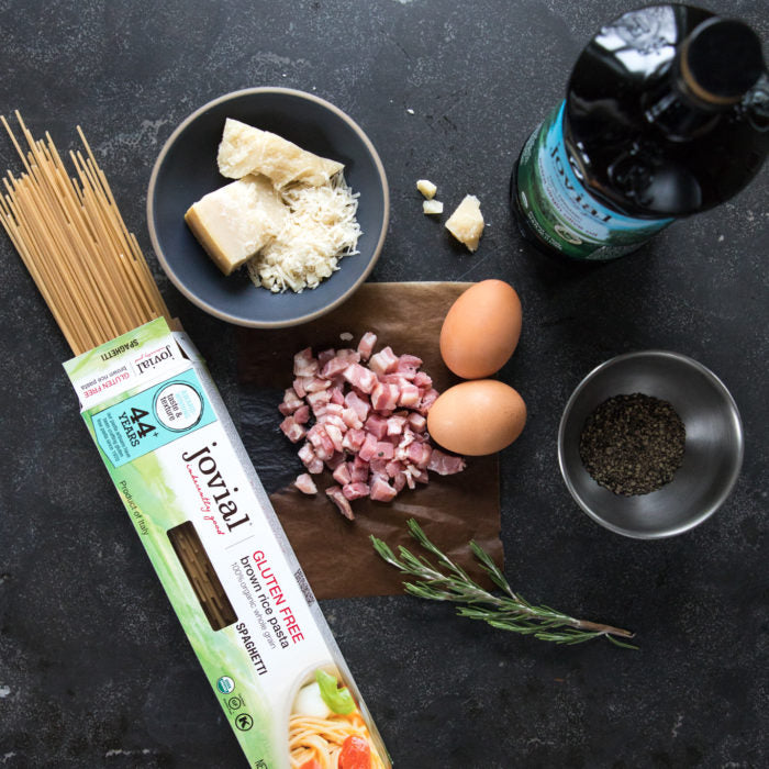 Ingredients for spaghetti carbonara: Jovial gluten free spaghetti, pancetta, eggs, Parmesan, rosemary, pepper, oil