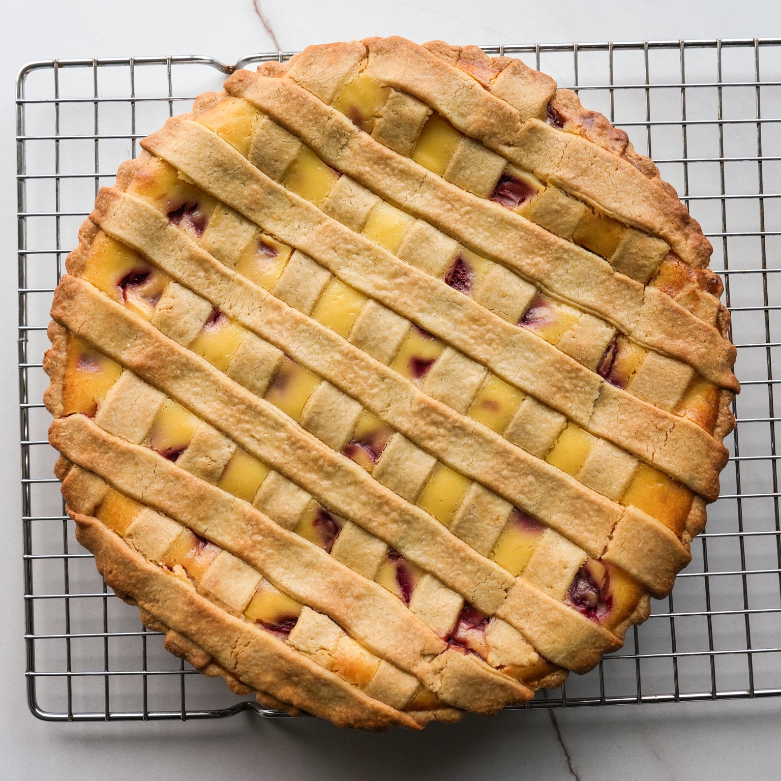 A crostata filled with strawberries and ricotta, made with an einkorn crust