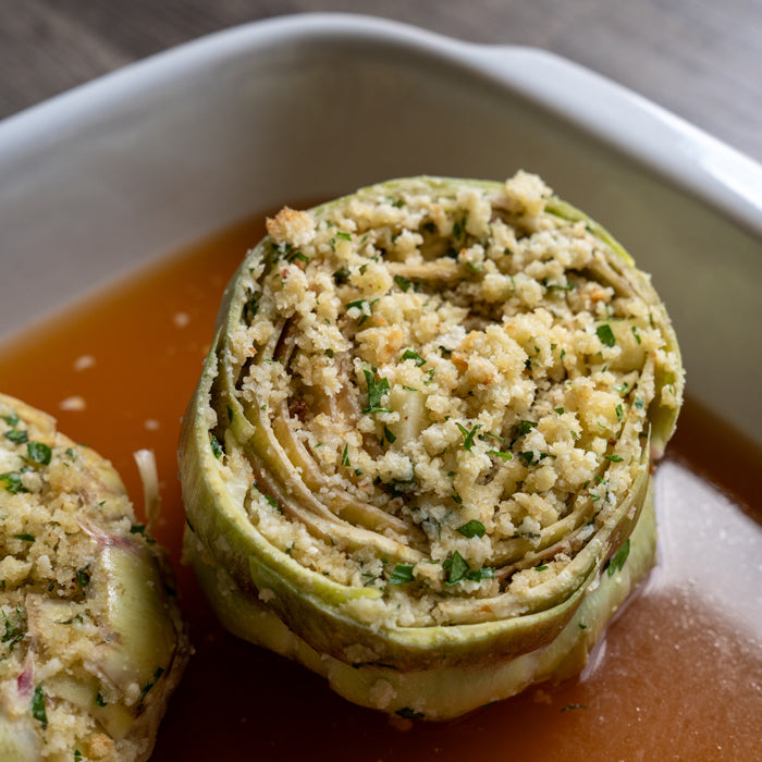 Artichoke stuffed with einkorn bread crumbs and herbs, before cooking