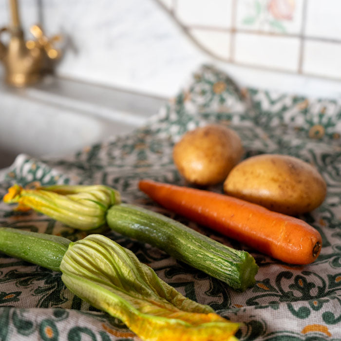 Washed Spring produce (zucchine, carrots, potatoes, in an italian kitchen