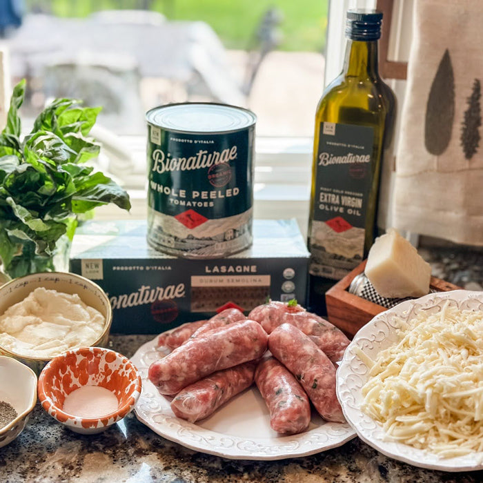 Ingredients for skillet lasagna: Bionaturae canned tomatoes and lasagne, raw sausages, shredded cheese, olive oil, basil