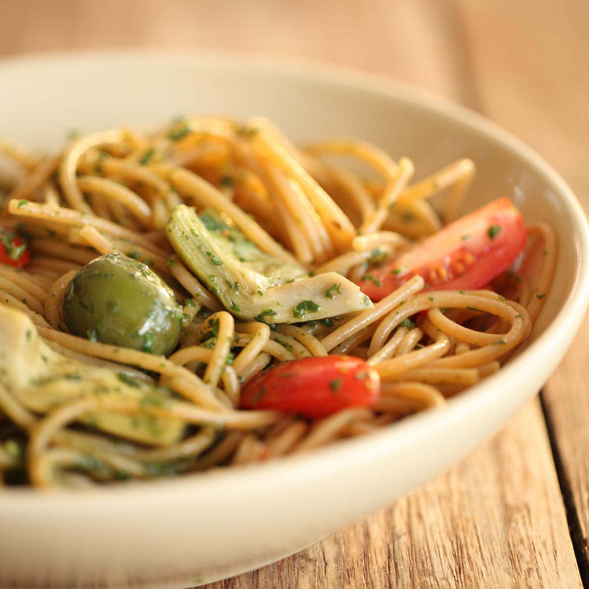 Front of package of Organic Einkorn Whole Wheat Spaghetti showcasing the 100 percent whole grain label on a white background