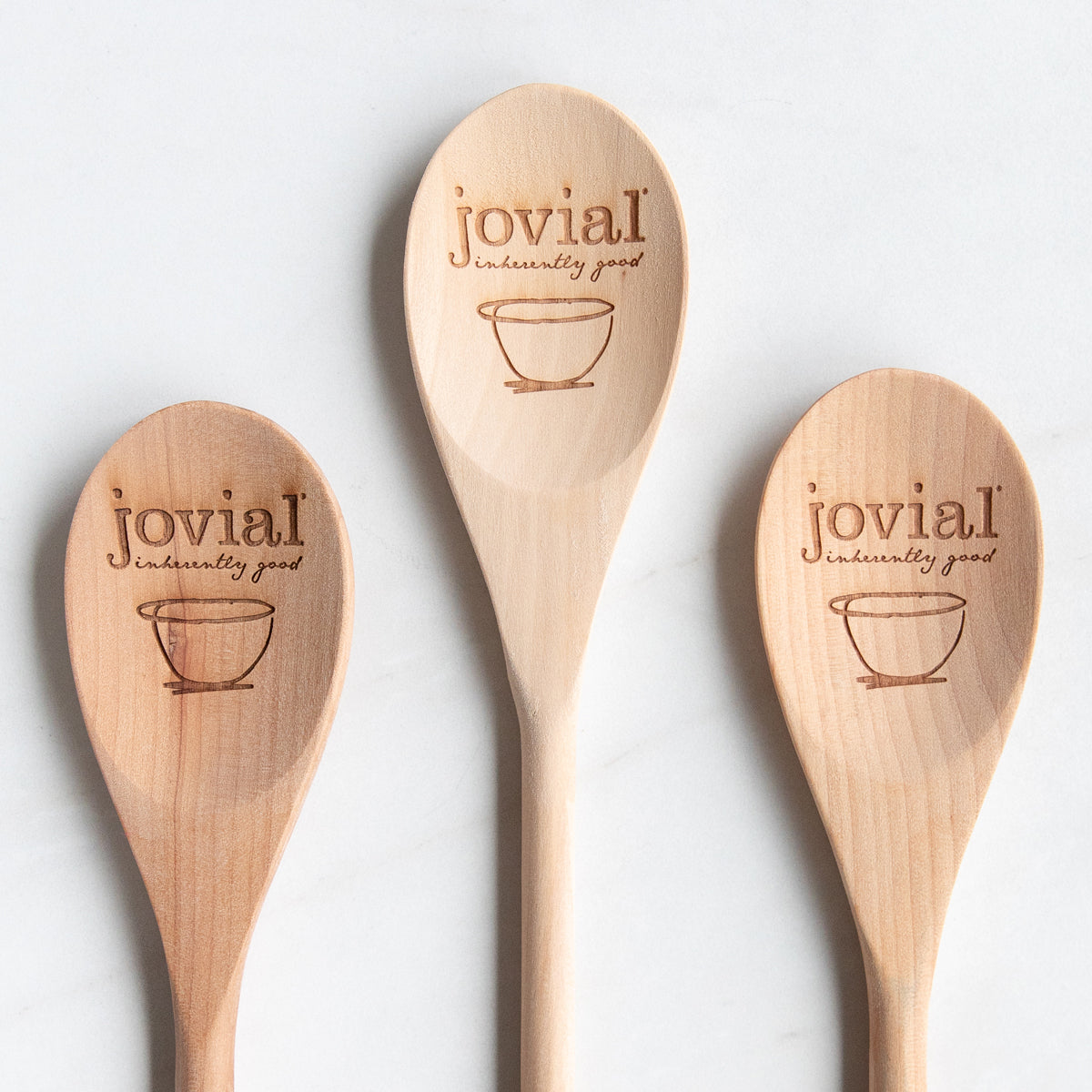 Front view of 12-inch birch wooden spoon showcasing engraved Jovial logo and smooth ergonomic handle on white background
