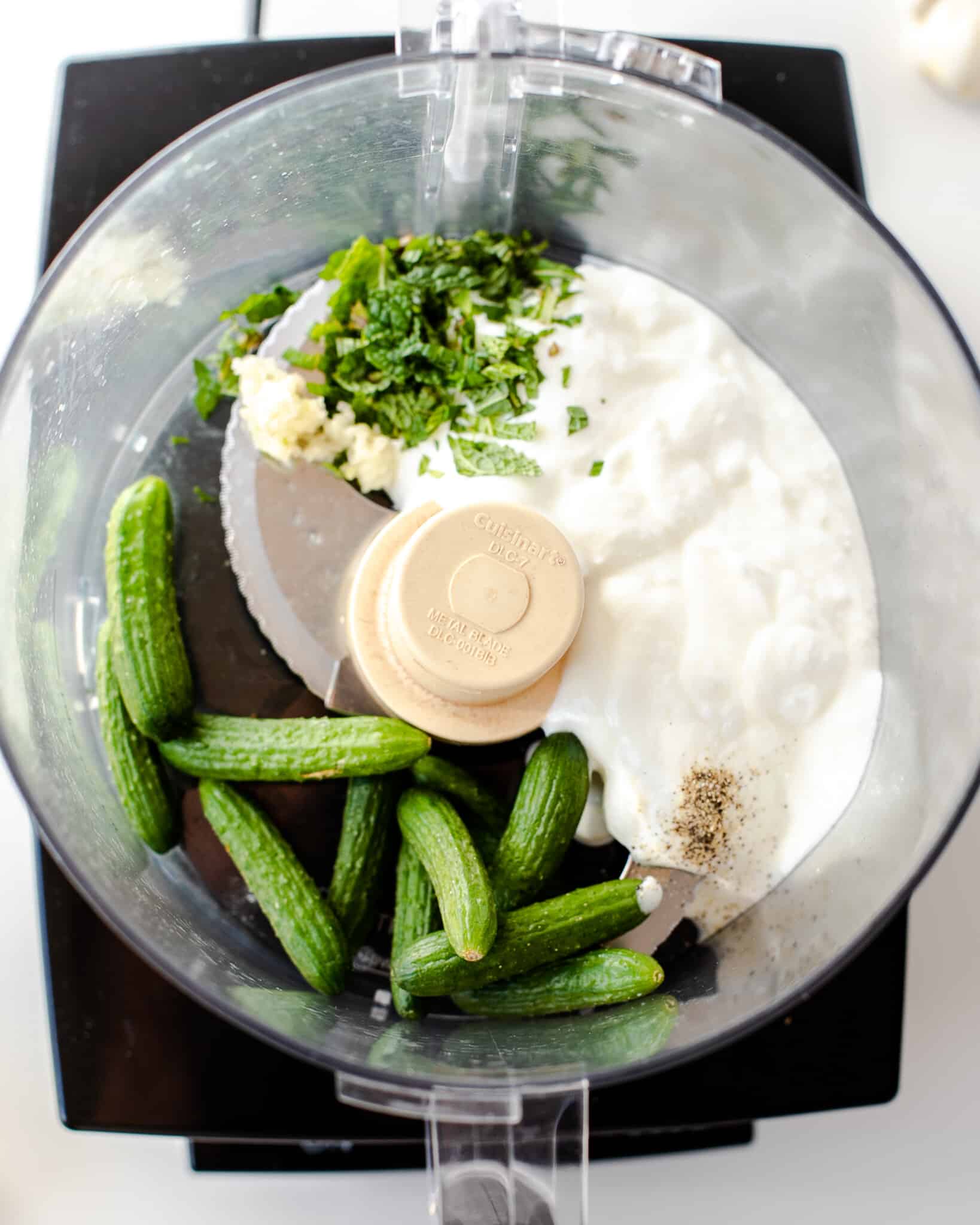 blending tzatziki sauce in the food processor