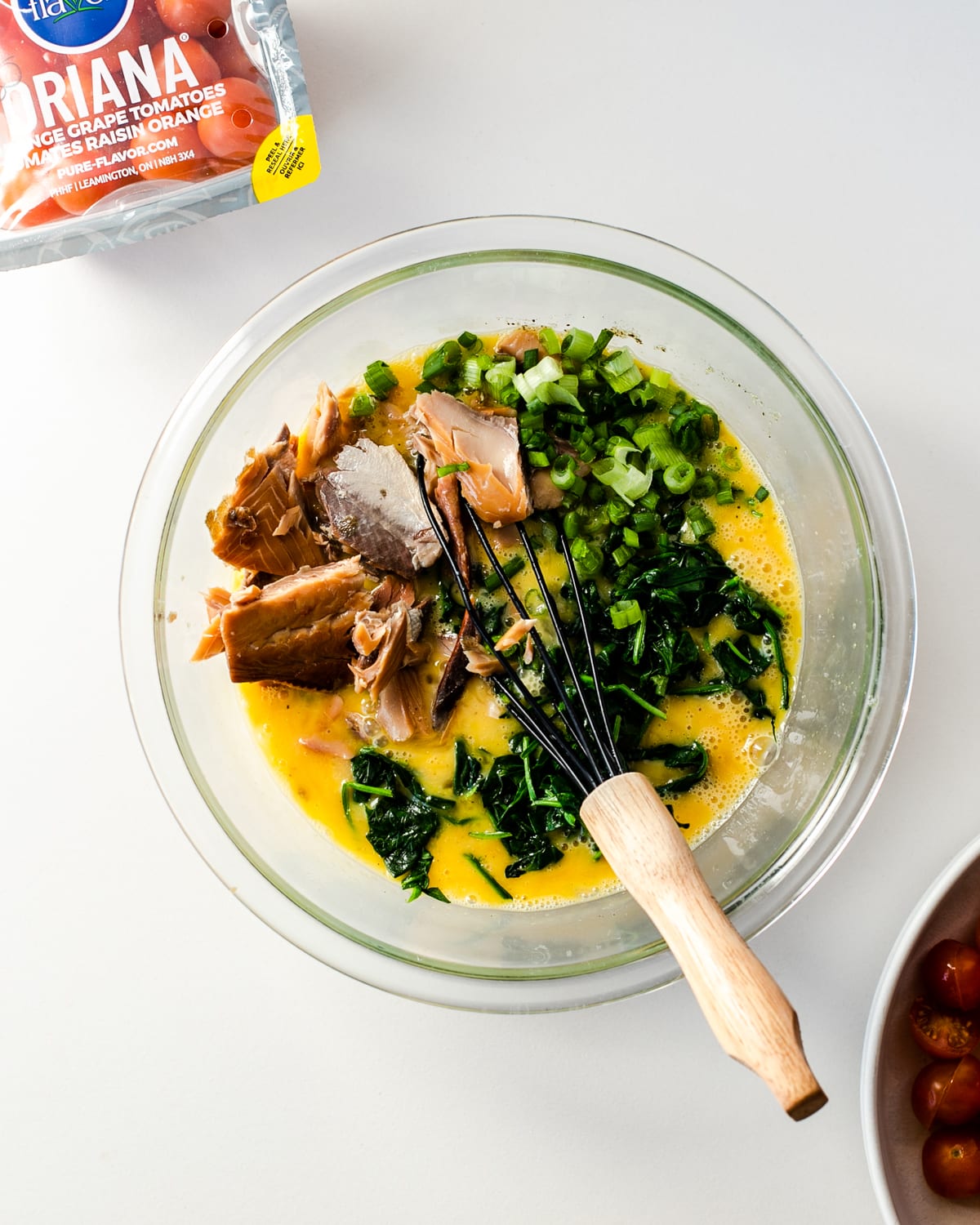 making tomato spinach smoked salmon breakfast casserole