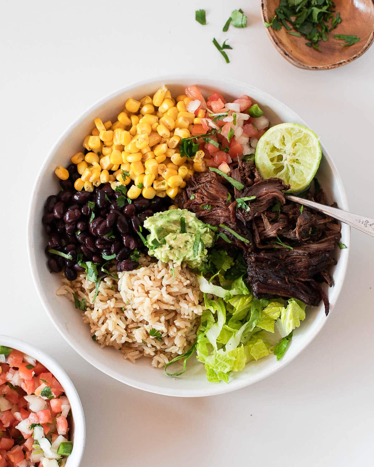 healthy burrito bowl with carne asada slow cooker recipe