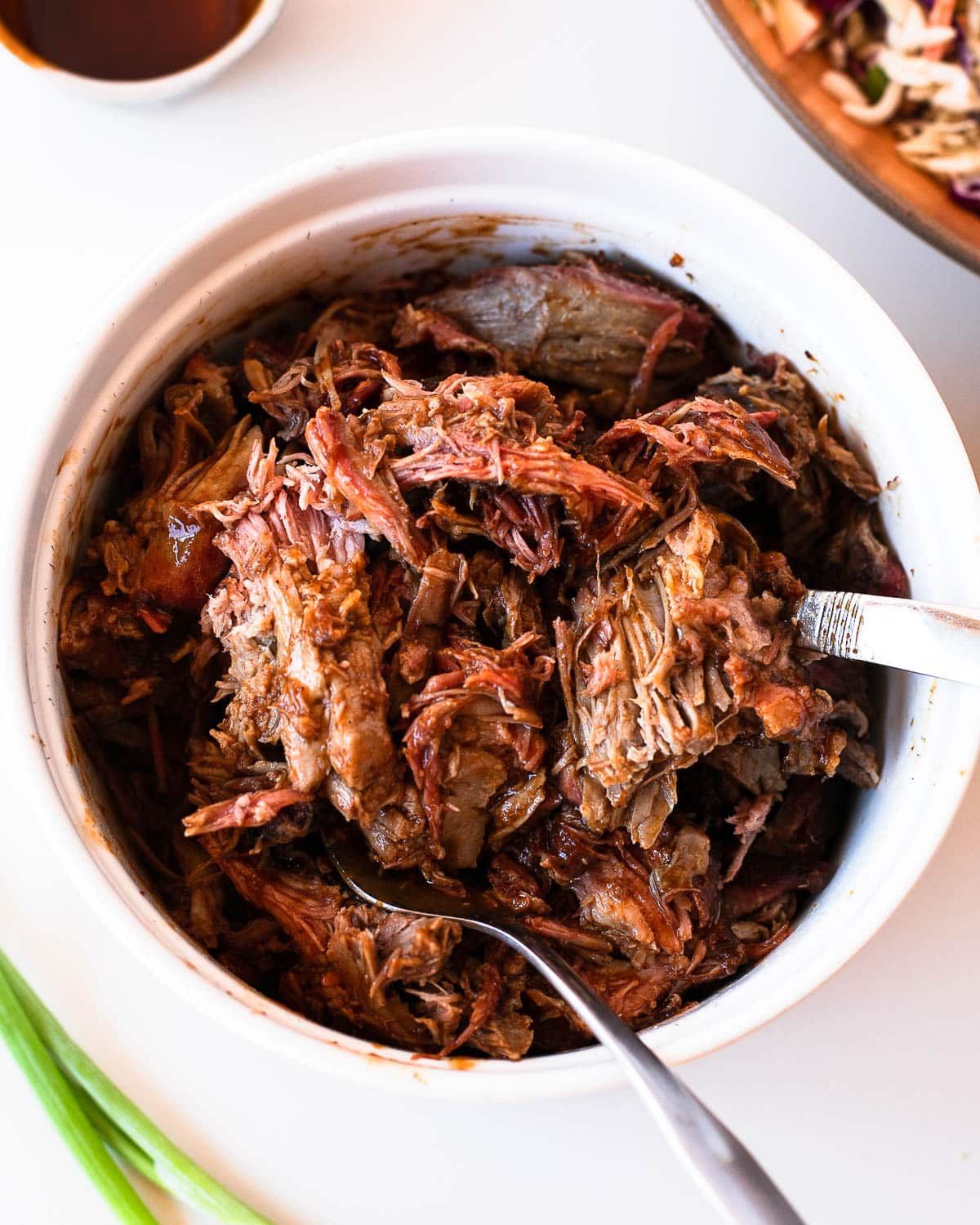 Finished Traeger pulled pork shredded with bbq sauce and ready to serve.