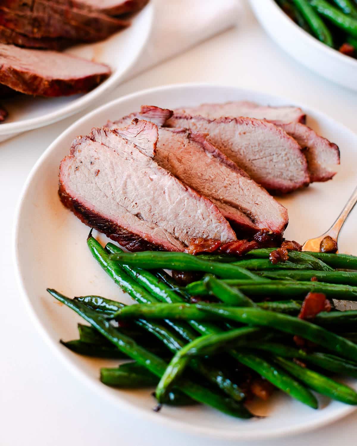 serving of meat on a plate after cooking in the flavorful tri tip marinade