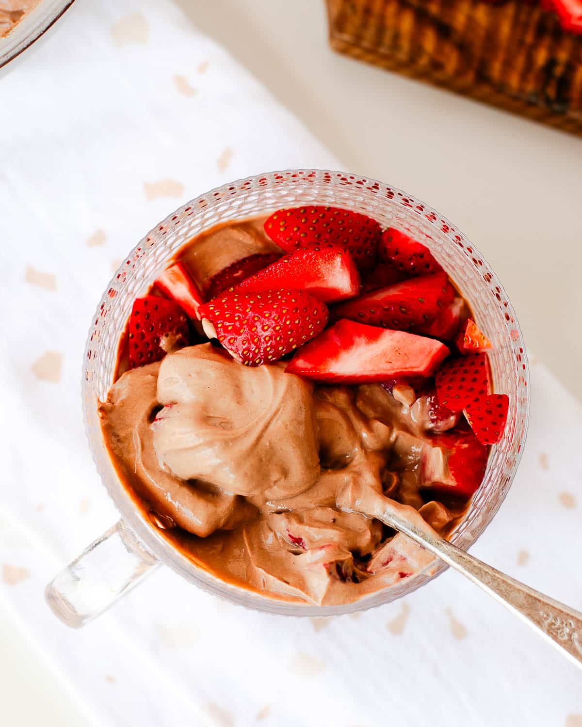 Ingredients for chocolate protein yogurt: Greek yogurt, cocoa powder, protein powder, peanut butter powder
