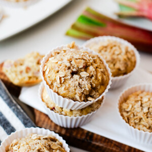 Close-up of a muffin stack highlighting the crunchy oat streusel texture.