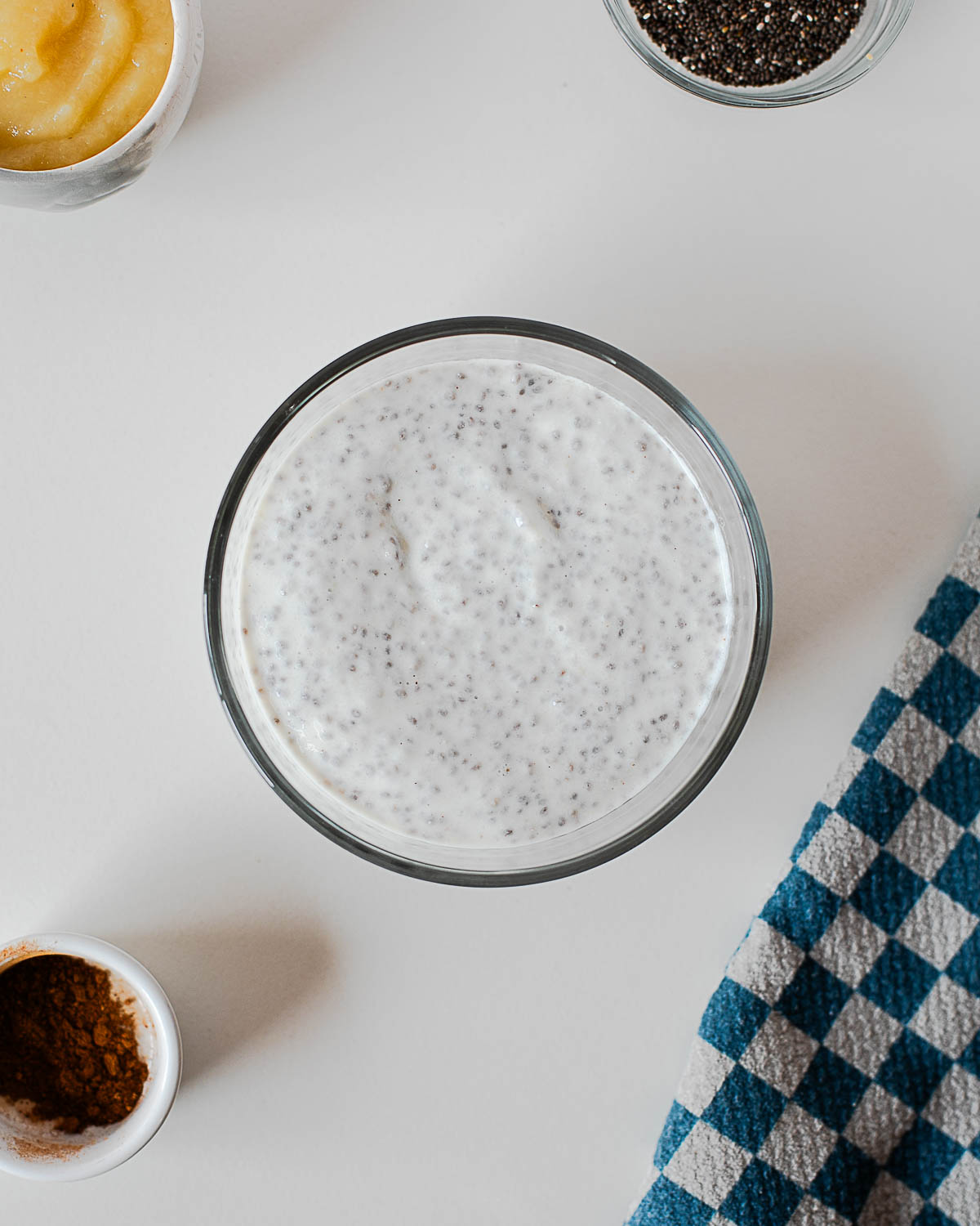 Apple pie chia pudding base in a glass bowl made with chia seeds and Greek yogurt