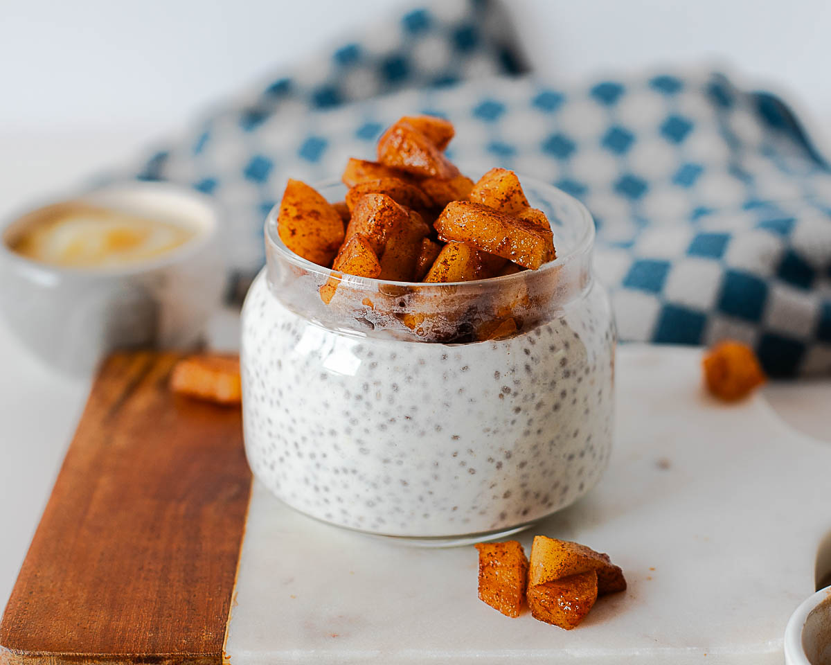 Apple pie chia pudding with spiced apples on top ready for meal prep breakfast