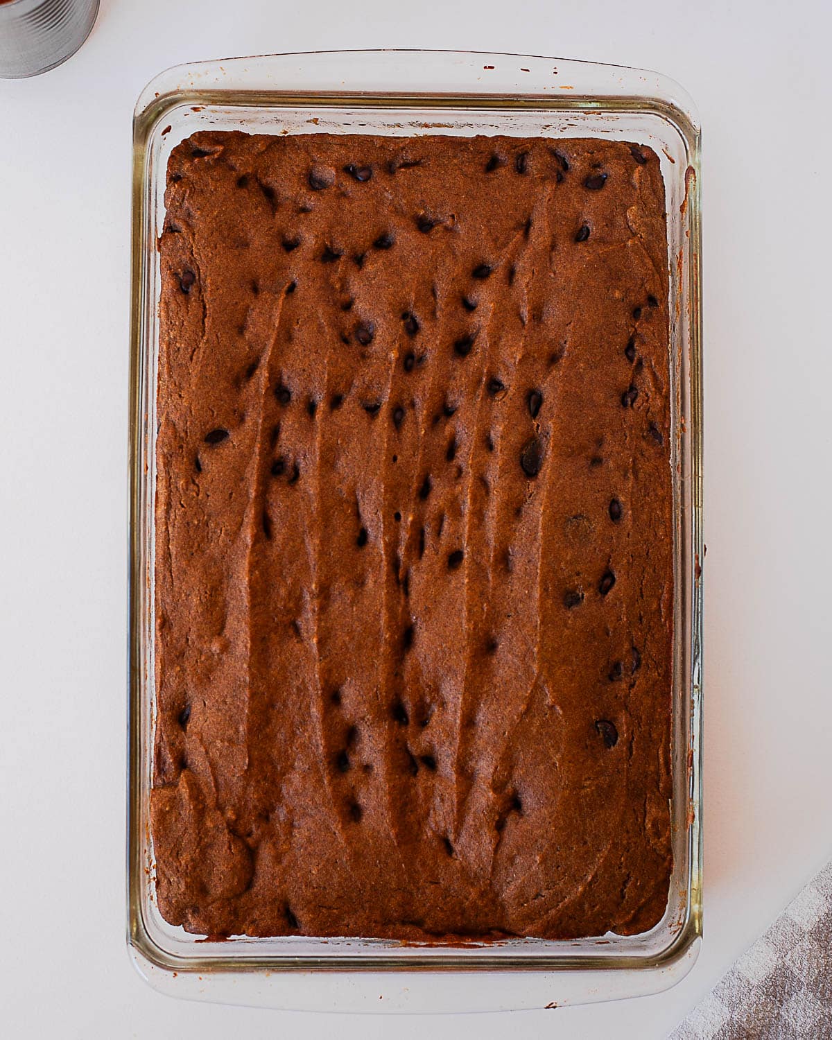 Baked pumpkin chocolate chip bars cooled in a glass baking dish