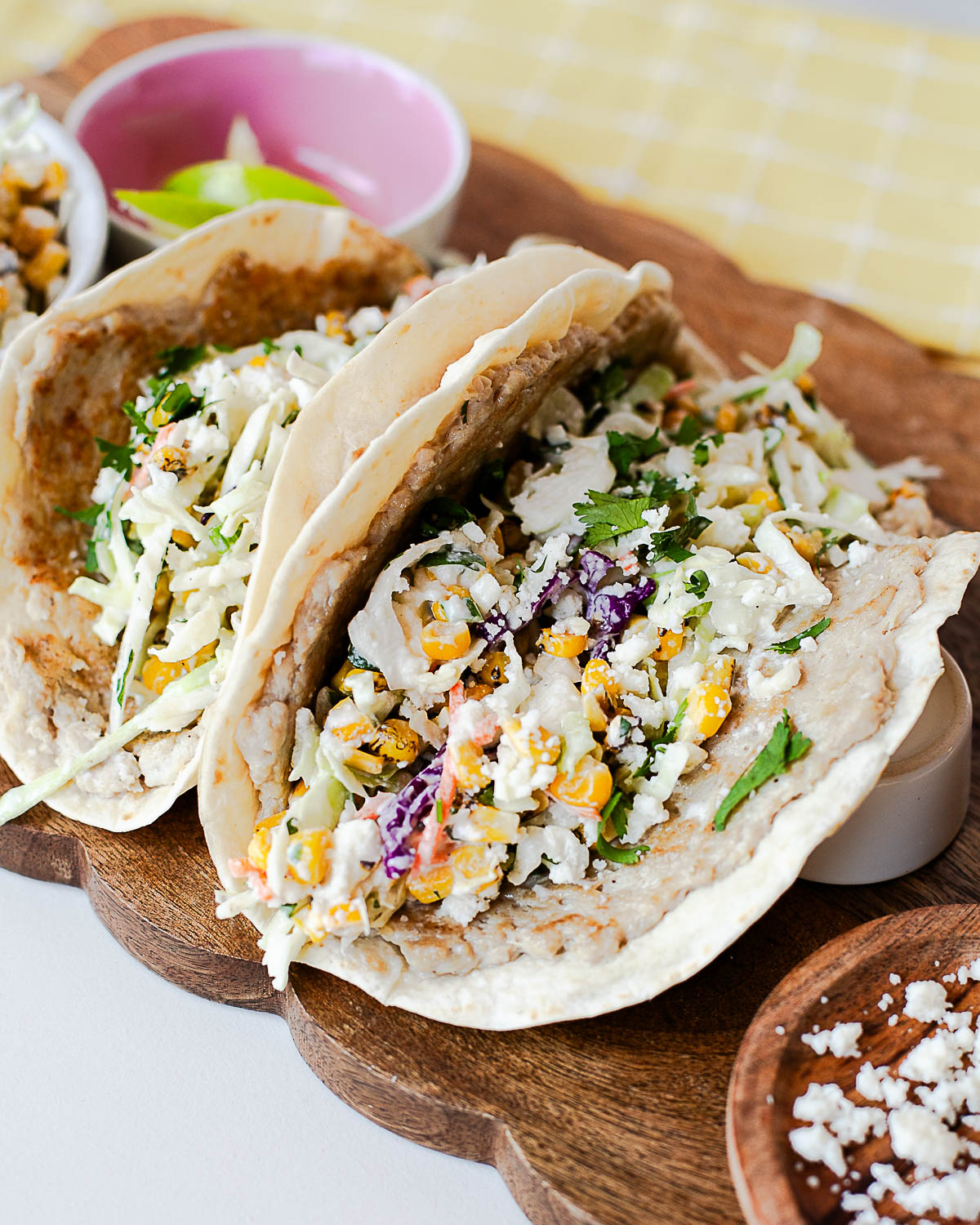 High-protein street corn chicken smash tacos with crispy tortillas, seasoned ground chicken, creamy corn slaw, cilantro, and queso fresco.